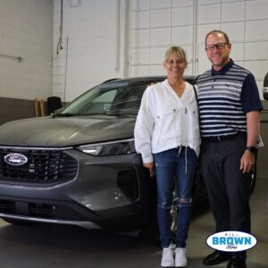 Chris Baxter, Bill Brown Ford Sales Consultant, posing with a customer who just bought a new Ford Escape ST-Line